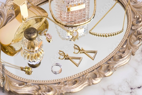 tray with jewelry and perfume