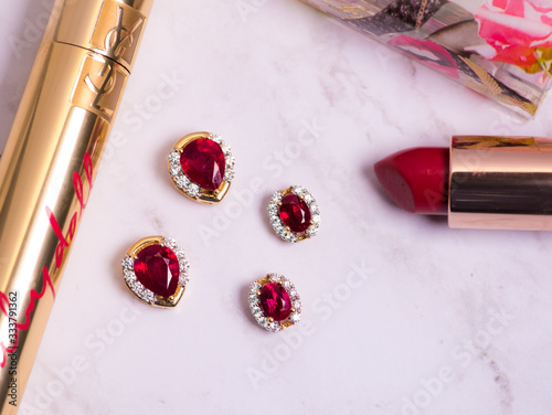 Ruby jewelry with makeup items