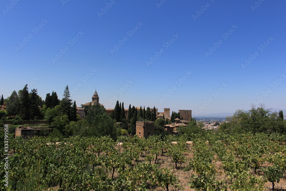 Historical Alhambra palace and fortress complex taken from Generalife gardens in Granada, Andalusia, Spain.