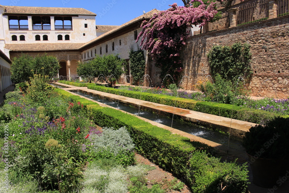 Patio of the Irrigation Ditch (Patio de la Acequia) of Generalife gardens at the historical Alhambra palace and fortress complex in Granada, Andalusia, Spain.