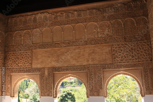 Historical wall carvings inside Generalife Palace at Alhambra palace and fortress complex in Granada, Andalusia, Spain. photo