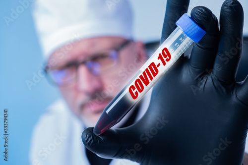 Covid-19. The doctor holds ...