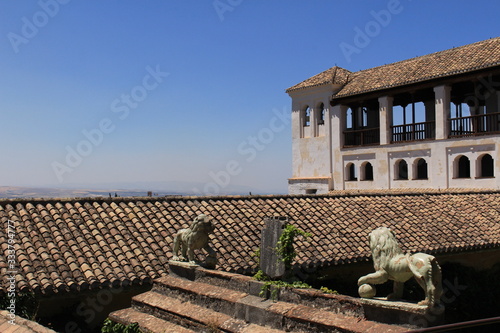 Court of the Sultana’s Cypress Tree (Patio de la Sultana) with two lion statues at Generalife gardens at Alhambra palace and fortress complex in Granada, Andalusia, Spain.