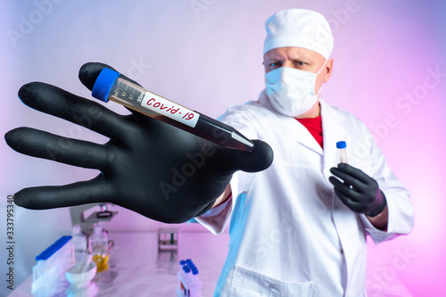 Doctor shows a test tube wi...