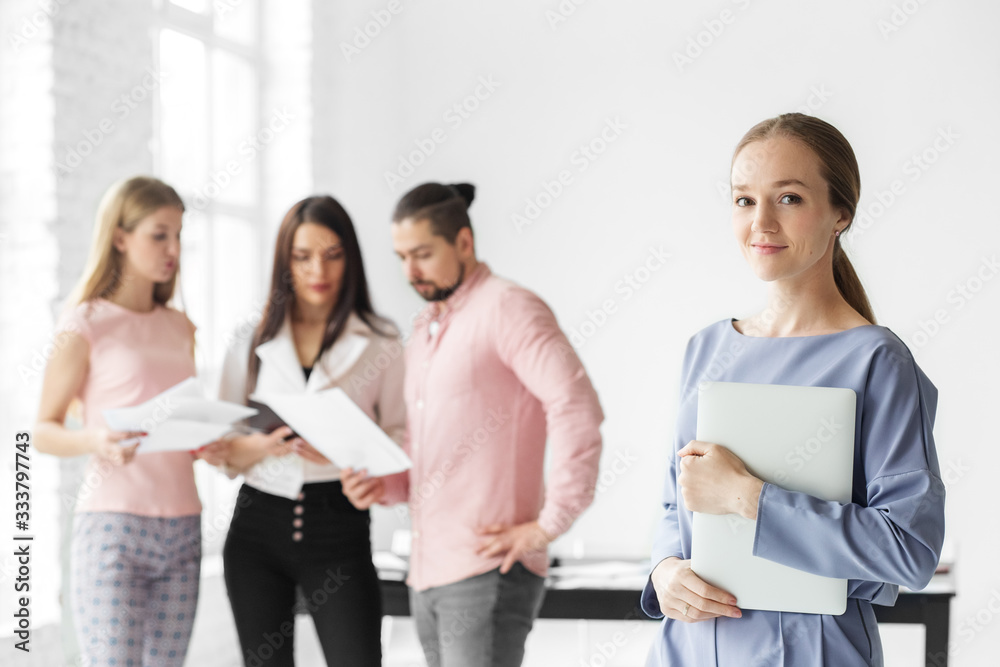 Business woman with a laptop. Team leader. The concept of entrepreneurs, business and work on success. Business woman with a laptop. Team leader. The concept of entrepreneurs, business and work on success.