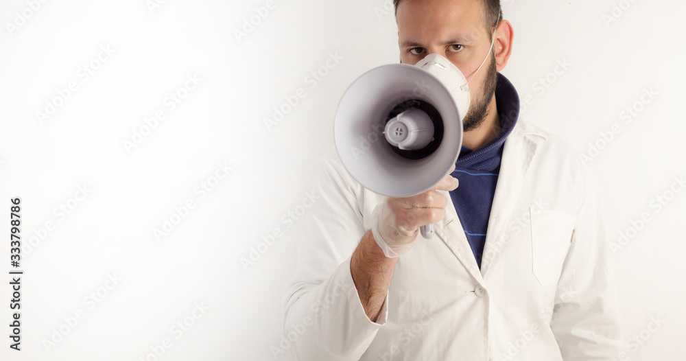 man dressed as a doctor speaking on a megaphone man dressed as a doctor speaking on a megaphone