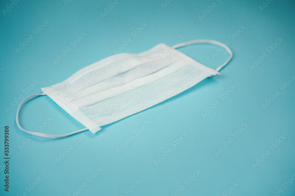 protective face mask on blue background protective face mask on blue background