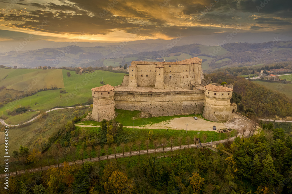 Aerial panorama sunset view of San Leo medieval prison fortress