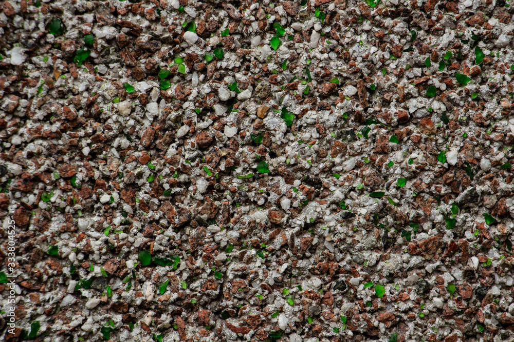 texture of small pebbles and small green glasses, close-up texture of small pebbles and small green glasses, close-up