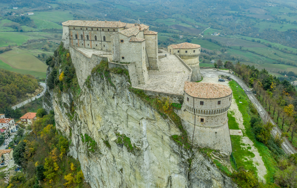 Aerial view of San Leo prison fortress with two cannon towers near San Marino and Rimini Italy