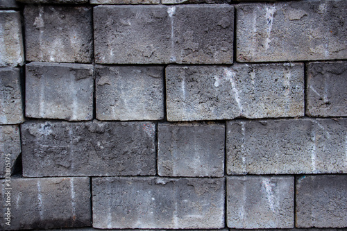 gray brick with white spots closeup background