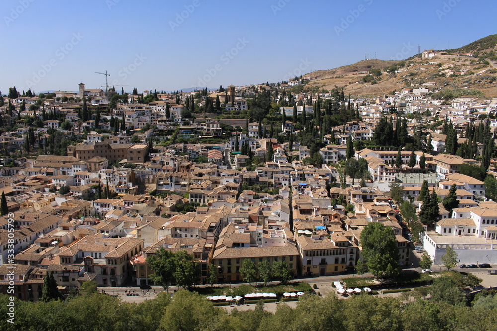 Aerial view of the Albaicin city taken from Daraxa's Garden (Jardines de Daraxa) of the historical Alhambra Palace complex in Granada, Andalusia, Spain.