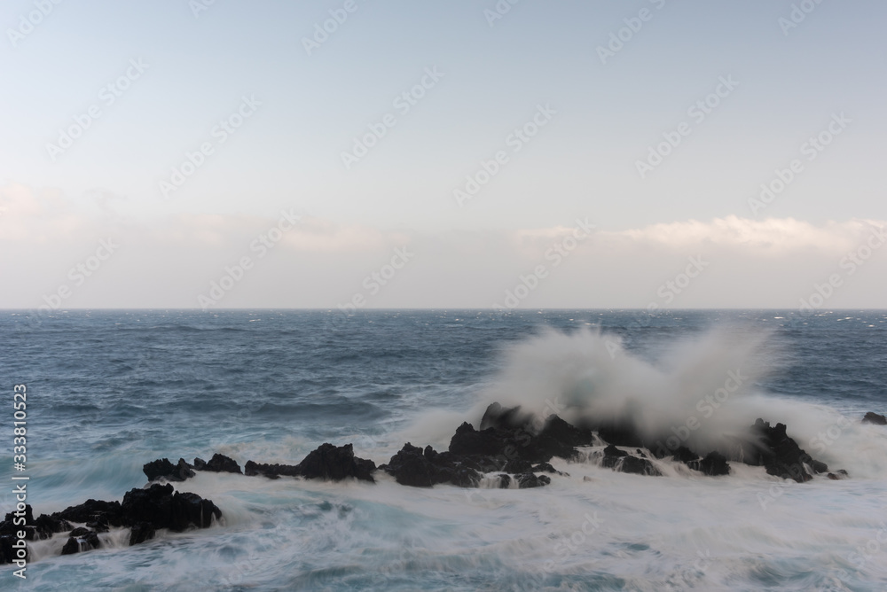 Waves splashing on the rocks. Porto Moniz, Madeira island. 