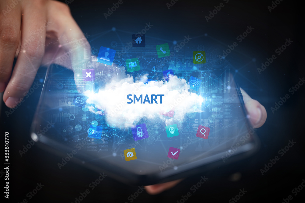 Businessman holding a foldable smartphone with SMART inscription, technology concept