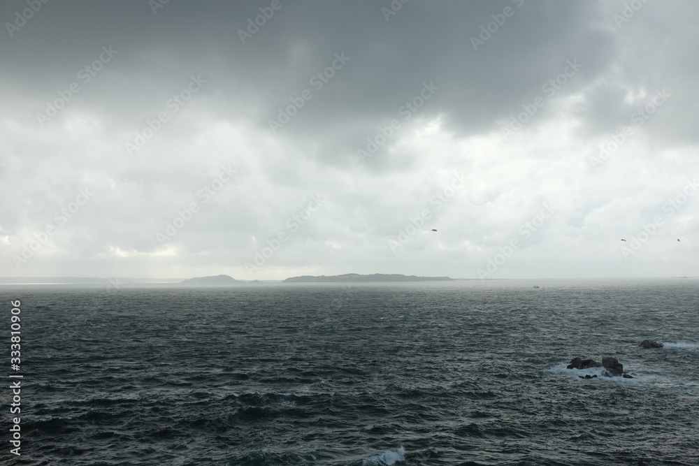 The Island of Herm Seen Spotted from Sark on a Dramatic Stormy Day