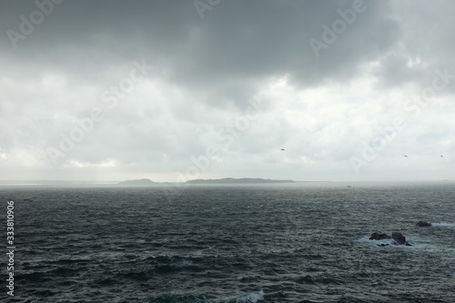 The Island of Herm Seen Spotted from Sark on a Dramatic Stormy Day