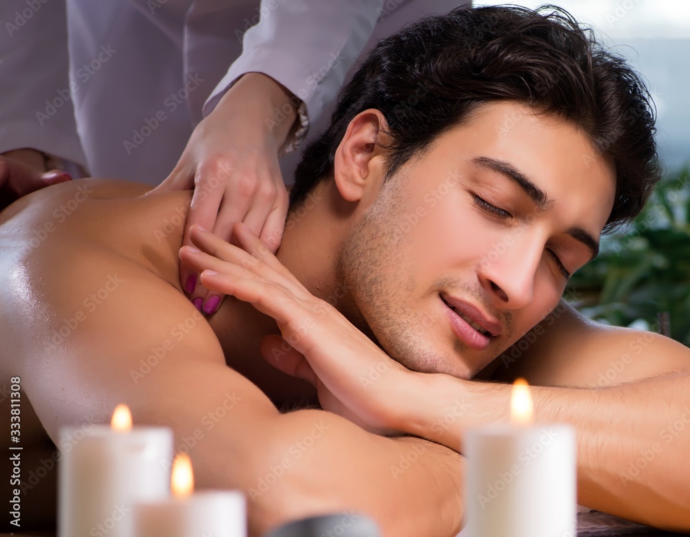 The young handsome man during spa procedure The young handsome man during spa procedure