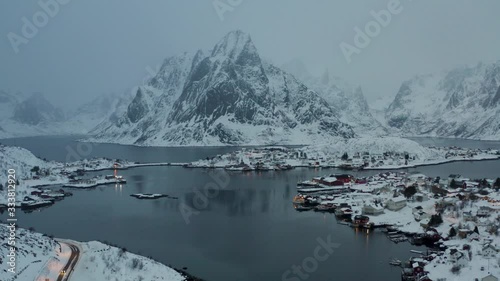 Panorama of Reine in Lofoten during the winter. Sharp mountains throw themselves into the sea, finding space among the many irregular islets that form the archipelago.
