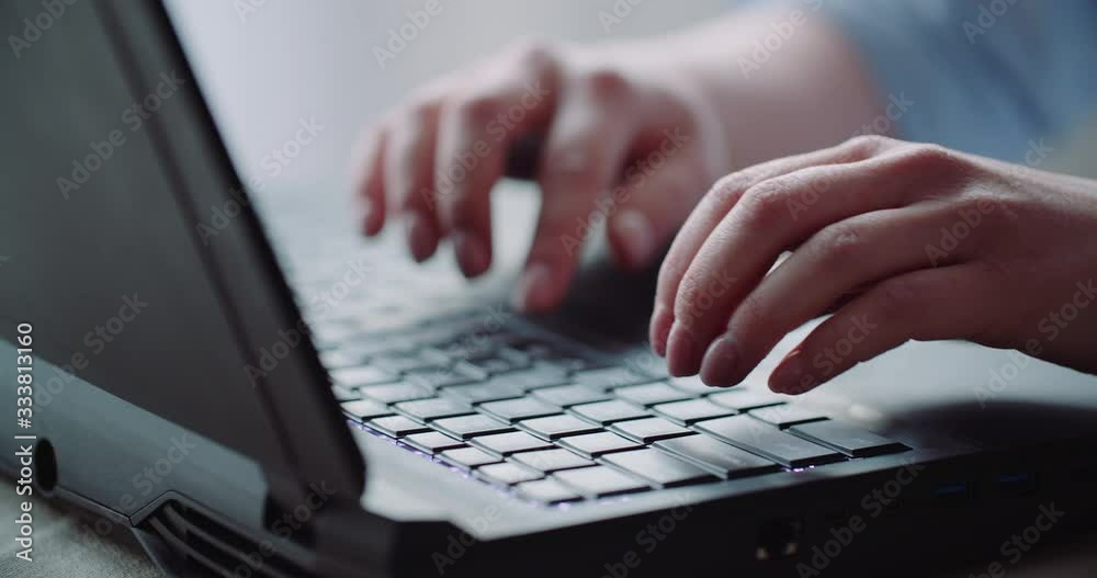 Young Businesswoman typing response to client email. Woman typing on Keyboard. Young Businesswoman typing response to client email. Woman typing on Keyboard.