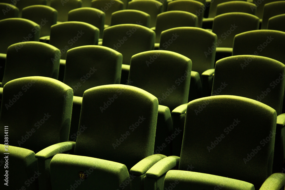 Fototapeta premium Green velvet seat in a theater