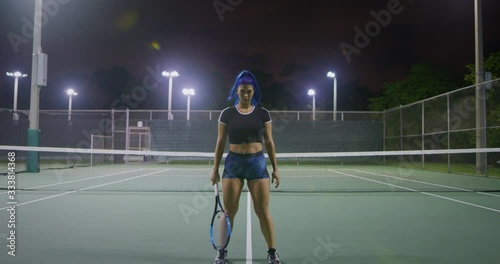 Tennis player girl looking in camera