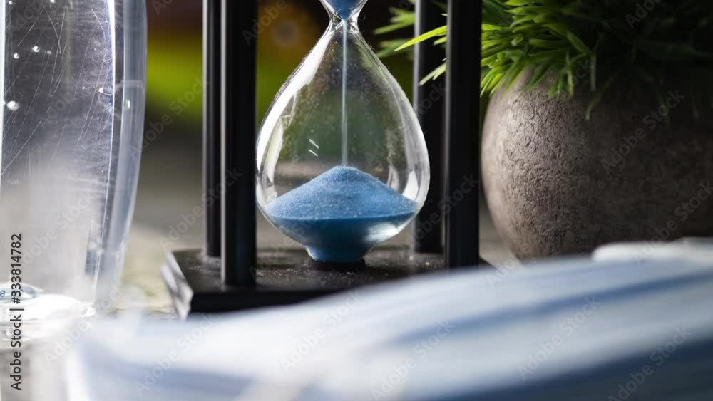 Conceptual time lapse of an hour glass on kitchen table.