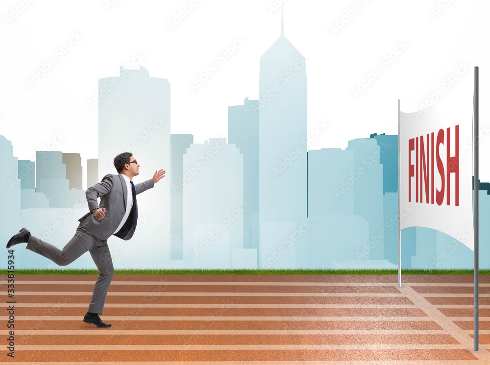 Businessman on the finishing line in competition concept Businessman on the finishing line in competition concept