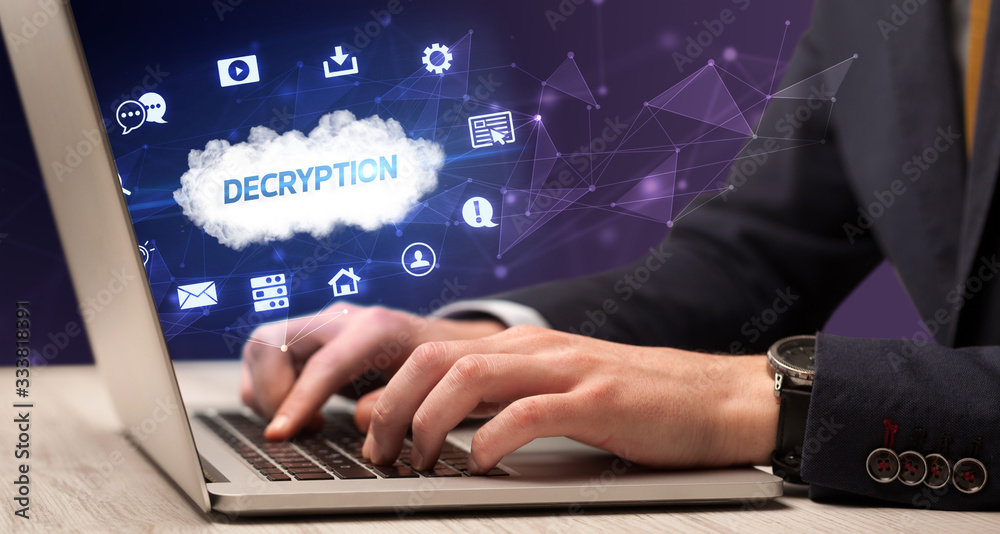 Businessman working on laptop with DECRYPTION inscription, modern technology concept Businessman working on laptop with DECRYPTION inscription, modern technology concept