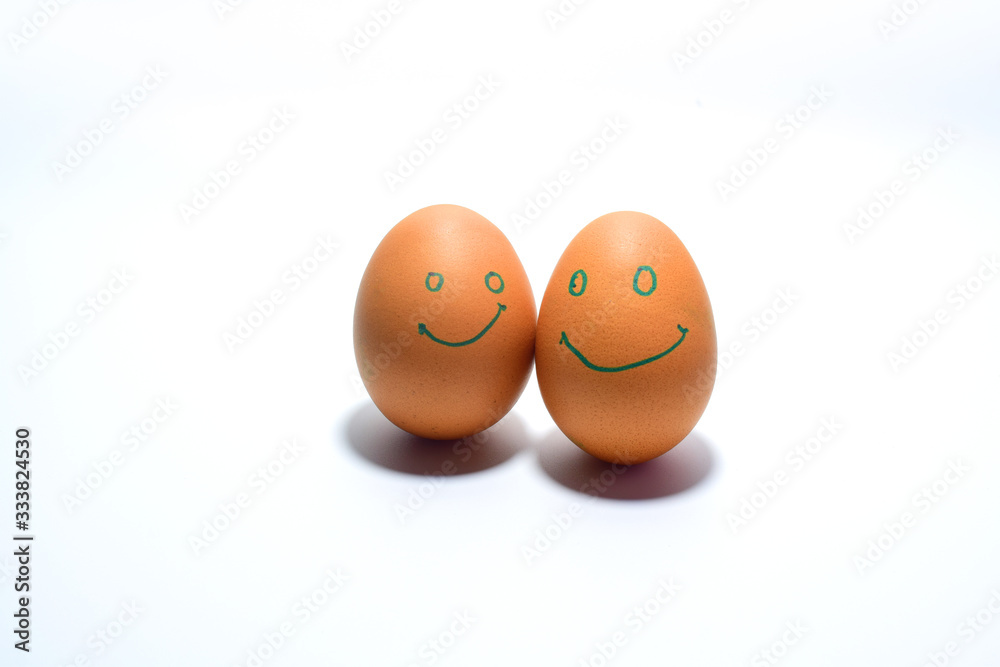 Smiling eggs on a white background