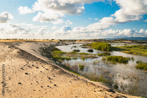 Scenic rural landscape  river  sand dunes  green hills. Guadalupe-Nipomo Dunes  California