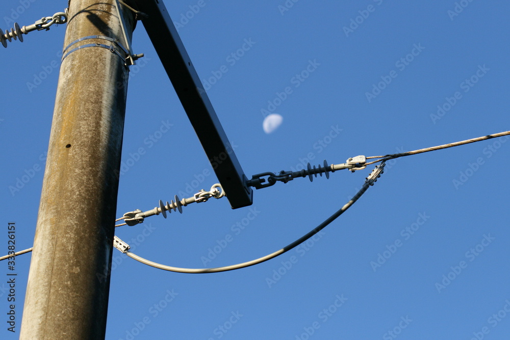 barbed wire on background of blue sky moon barbed wire on background of blue sky moon