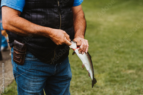 person catch a fishing trout © Natalia