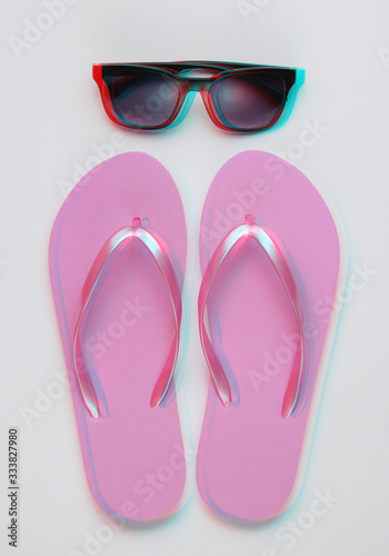 Summer still life. Beach accessories. Fashionable beach pink flip flops, sunglasses on white paper background. Glitch effect