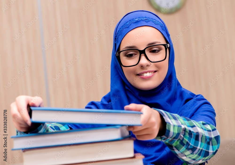 Muslim girl preparing for entry exams Muslim girl preparing for entry exams