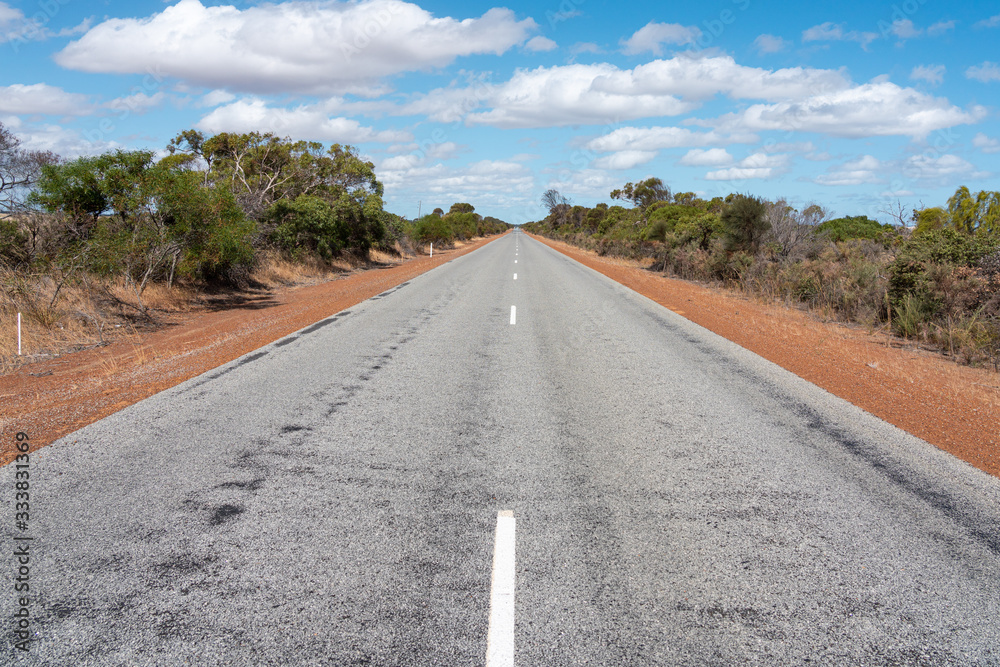 Fototapeta premium Empty straight road in the sun