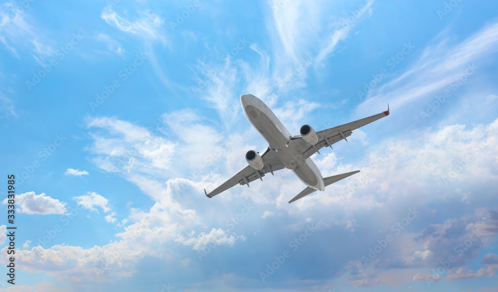 Commerical passenger airplane in the clouds. travel by air transport Commerical passenger airplane in the clouds. travel by air transport