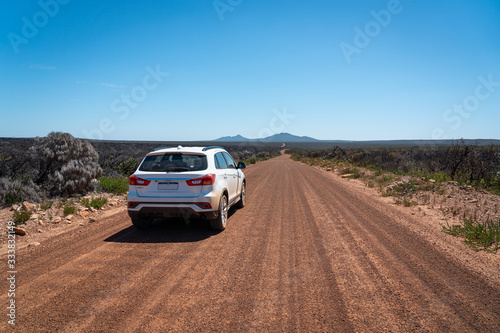 Car on an empty gravel road