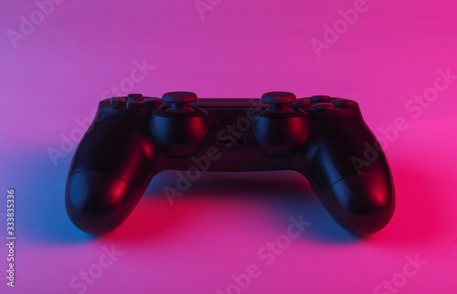 Gamepad with neon blue-pink light. Gaming concept.