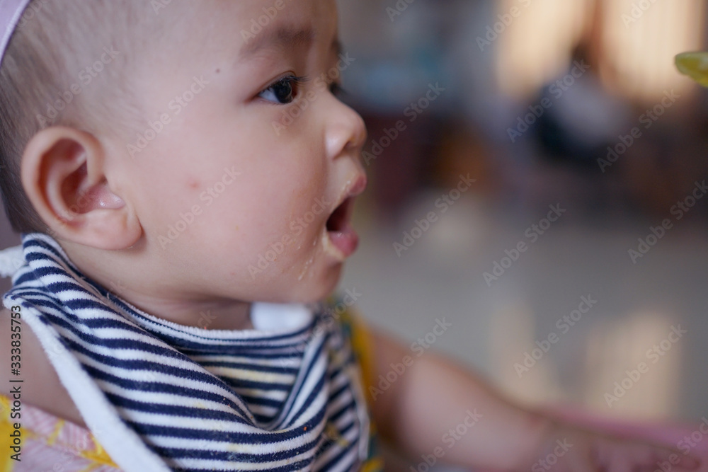 Infant girls eating mashed potatoes mixed with water. Infant girls eating mashed potatoes mixed with water.