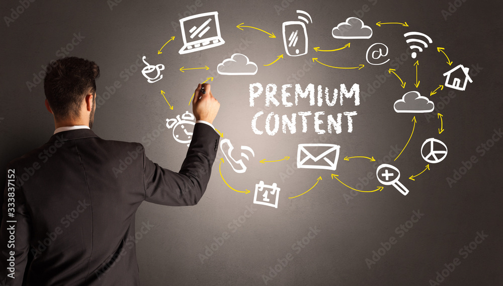 businessman drawing social media icons with PREMIUM CONTENT inscription, new media concept businessman drawing social media icons with PREMIUM CONTENT inscription, new media concept
