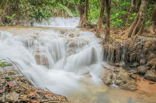 view of silky waterfall around with green forest background  Kroeng Krawia Waterfall  Sangkhla Buri  Kanchanaburi  west of Thailand.