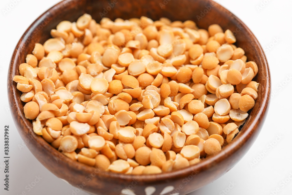 Dried chickpea lentils in wooden bowl on white background , Split Chickpea Also Know as Chana Dal Dried chickpea lentils in wooden bowl on white background , Split Chickpea Also Know as Chana Dal