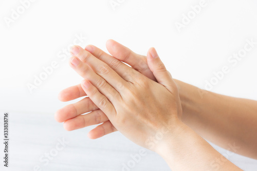 close up of a woman holding her hands