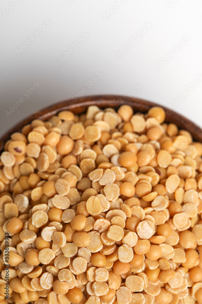 pigeon pea also known as toor dal in wooden bowl. pigeon pea also known as toor dal in wooden bowl.