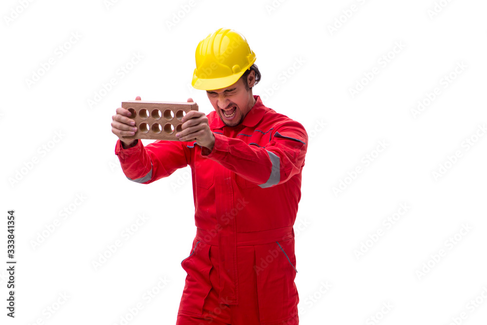 Young male mason with brick isolated on white Young male mason with brick isolated on white