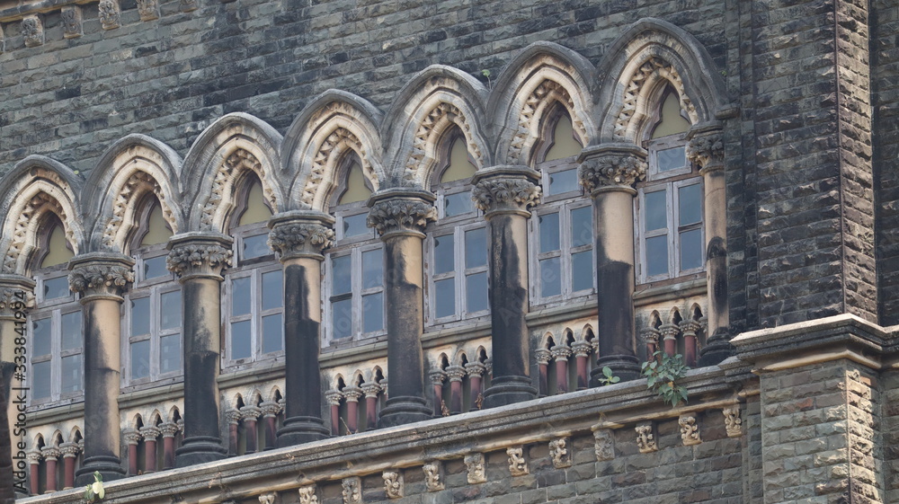 Mumbai, Maharastra/India- March 25 2020: Windows of an old gothic structure of the victorian era.