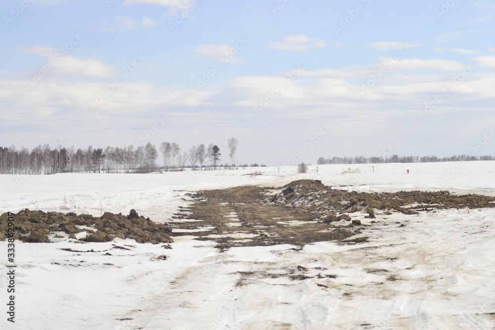 winter landscape with clay road