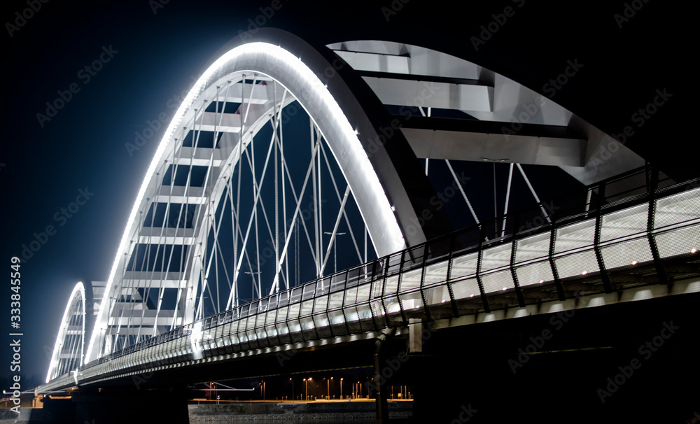 Arch Bridge by night. White bridge. Suspension bridge. Arch Bridge by night. White bridge. Suspension bridge.