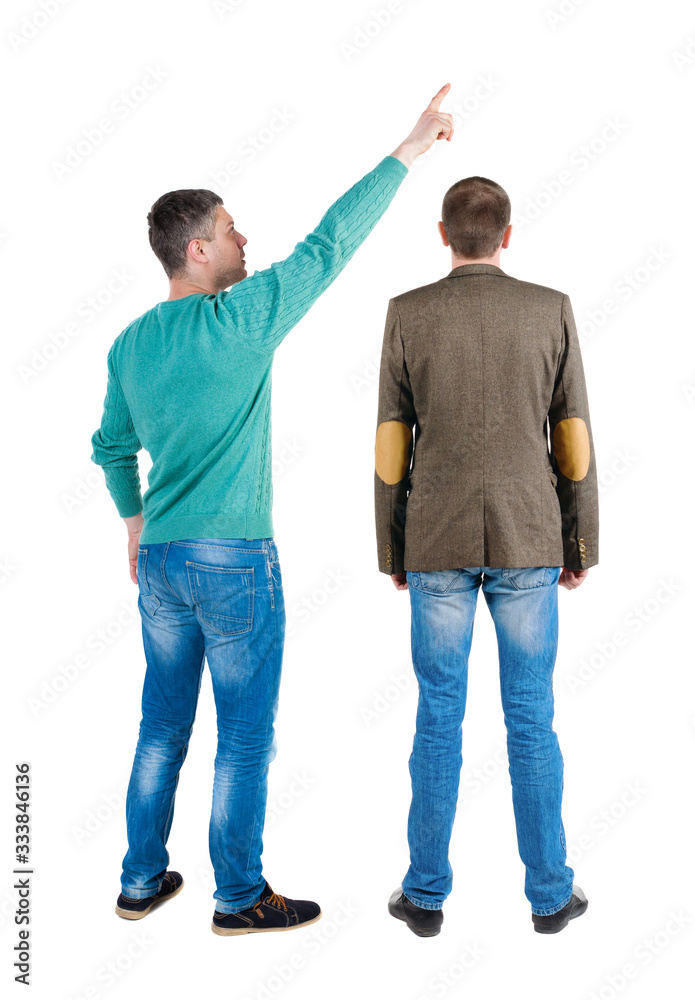 Back view of two man in sweater pointing. Back view of two man in sweater pointing.