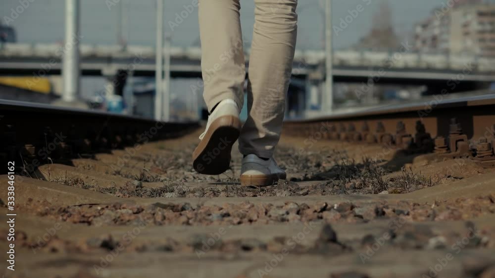 Man Walks To Home On Railroad Tracks After Canceled Public Transport .Tourist Legs Walking On Railway Middle Of Rail.Lonely Businessman Feet In Pants Walking On Rail Road When Train Or Tram Cancelled